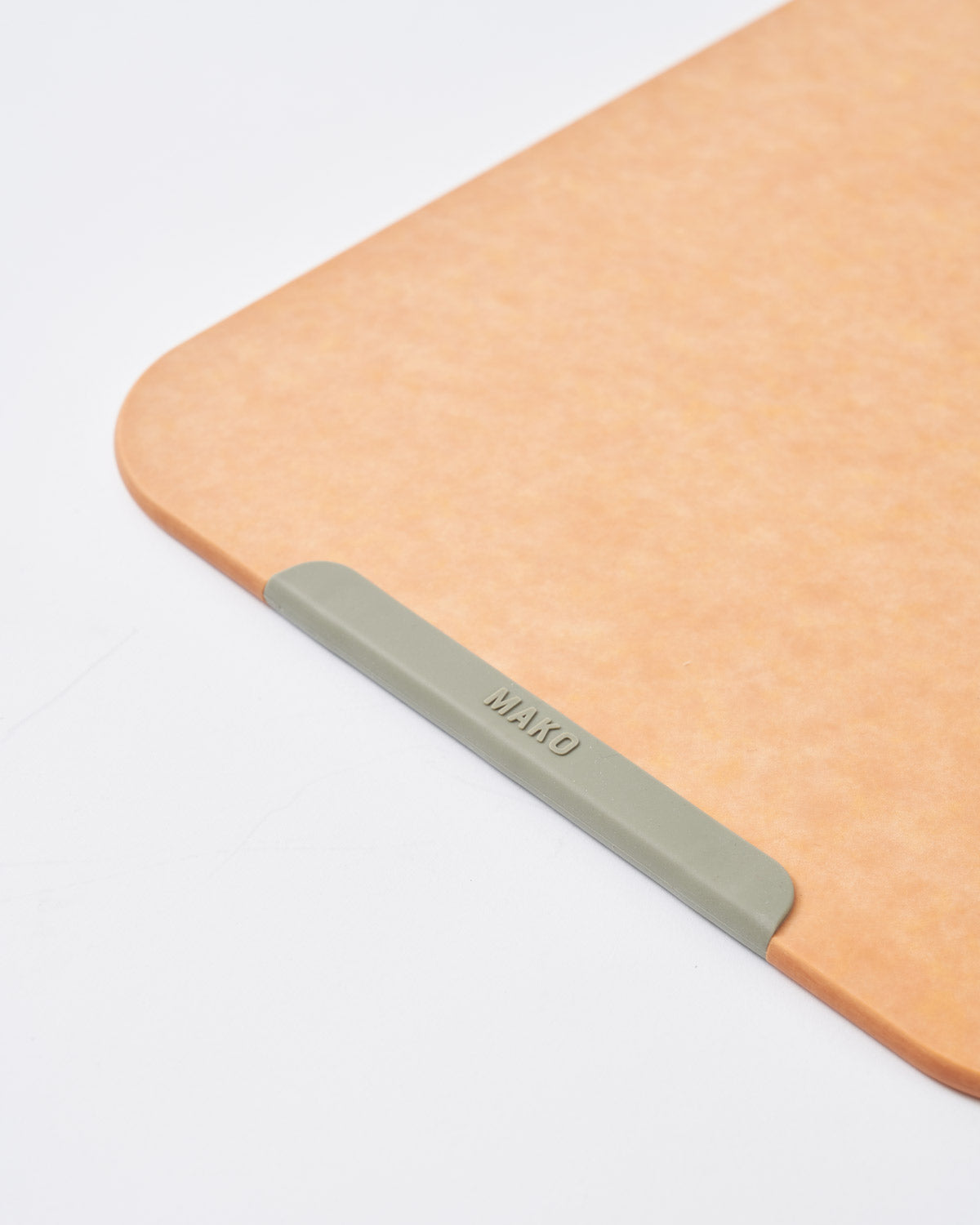 Large wood fibre chopping board with non-slip edge on white background