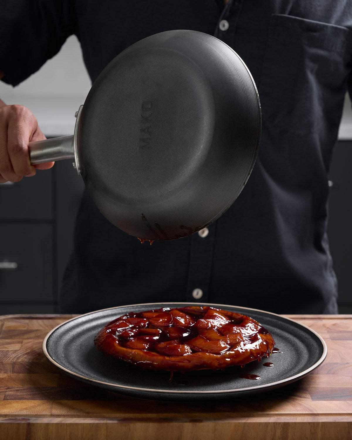 MAKO Black Steel 20cm & 31cm Frying Pan Duo - CookDineHost apple tarte tatin onto plate