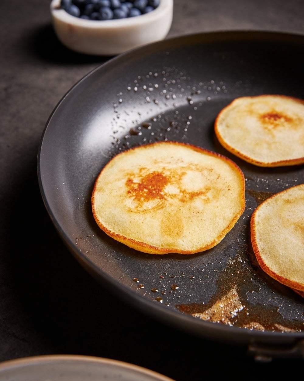 MAKO Genius 5-Ply 30cm Non-Stick Frying Pan CookDineHost - up close with pancakes in pan