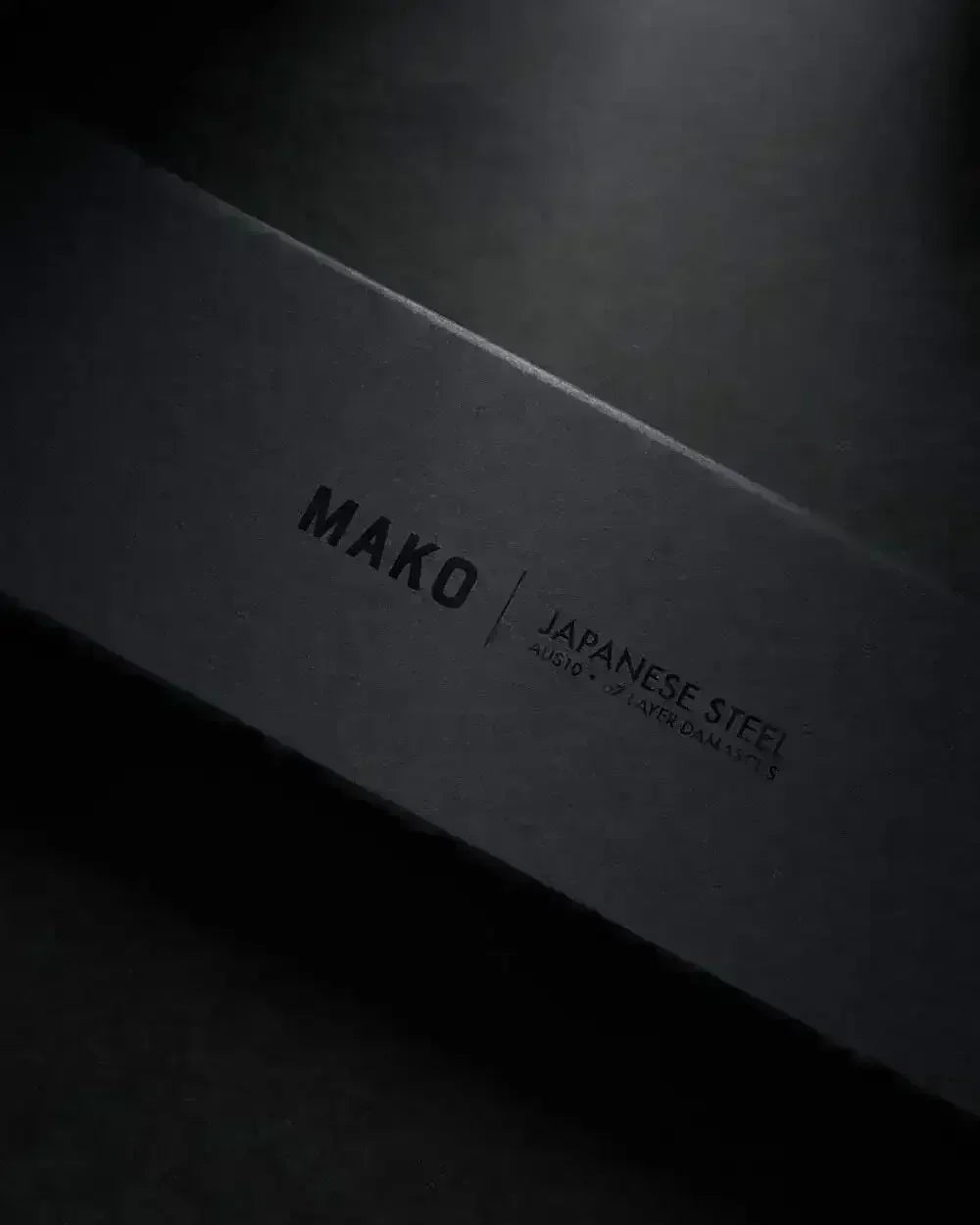 Black MAKO Japanese steel knife set box with minimal text on dark background