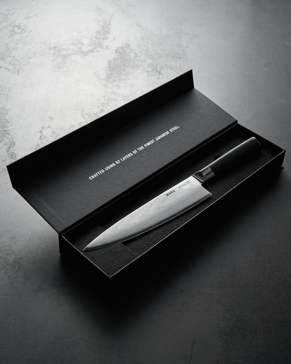 8-inch Japanese steel chef knife with olive green handle in open black gift box