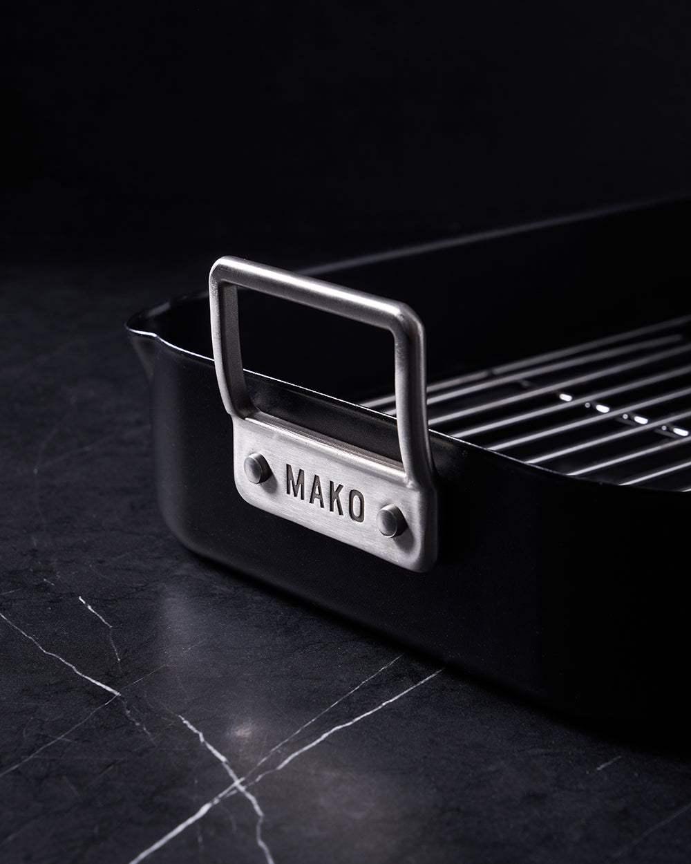 Mako Aero non-stick classic roaster with stainless steel handle on black marble surface by Marion Grasby