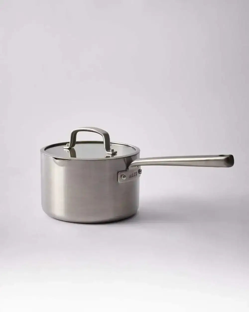 Stainless steel Mako saucepan with lid and long handle on light background, Marion Grasby chef