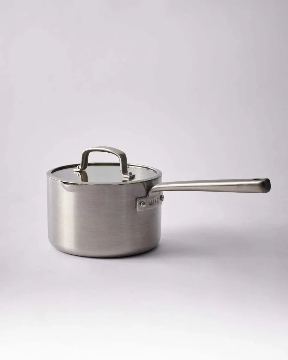 Stainless steel Mako saucepan with lid and long handle on light background, Marion Grasby chef