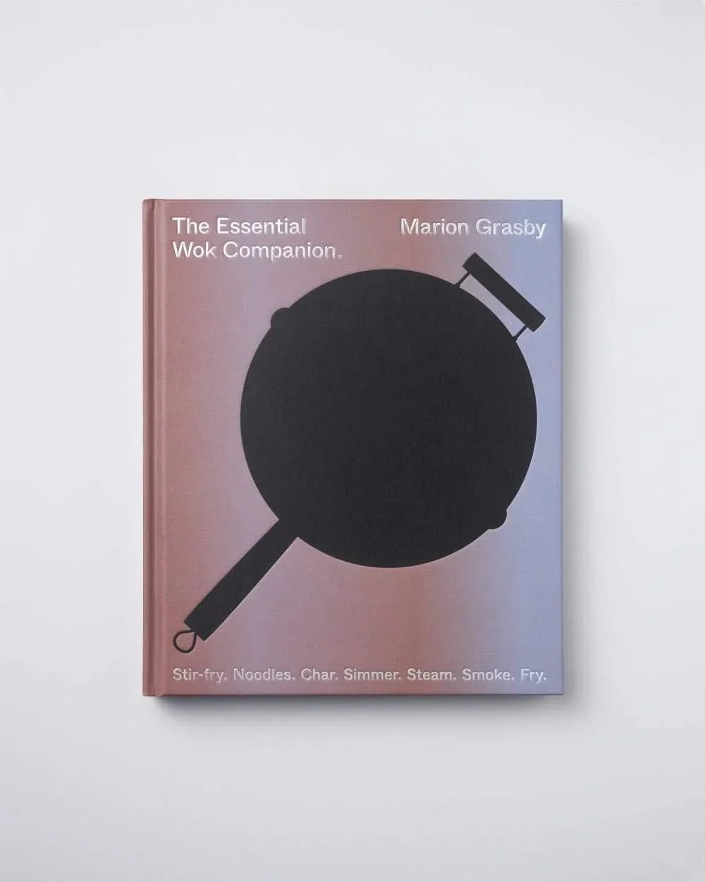 Cookbook The Essential Wok Companion by Marion Grasby with a black wok silhouette on cover