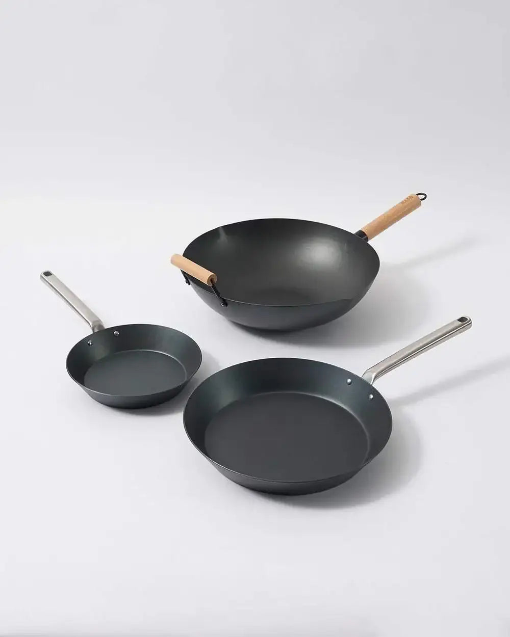 Mako black steel 3-piece cookware set including wok and two frying pans with wood and metal handles