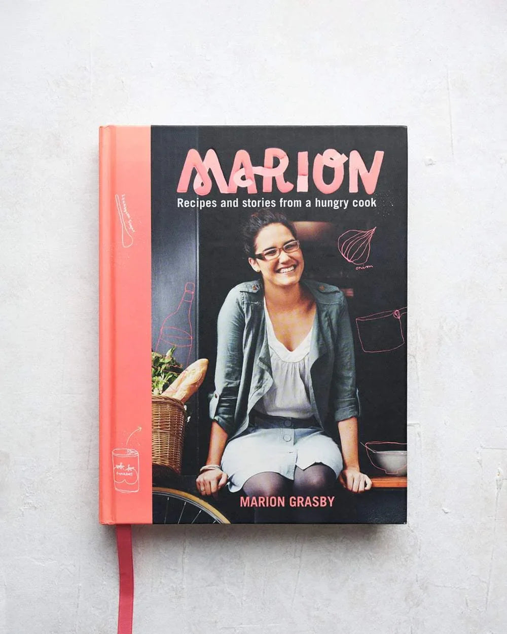 Cookbook titled Marion by Marion Grasby featuring recipes and stories from a hungry cook with smiling woman on cover