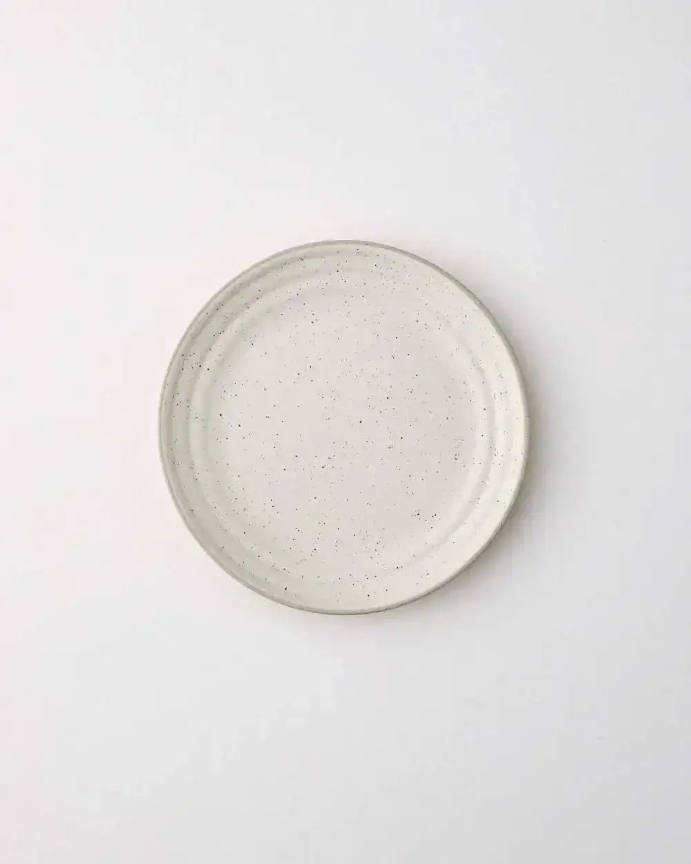 Asoke speckled side plate by Marion Grasby, minimalist white ceramic with subtle black flecks