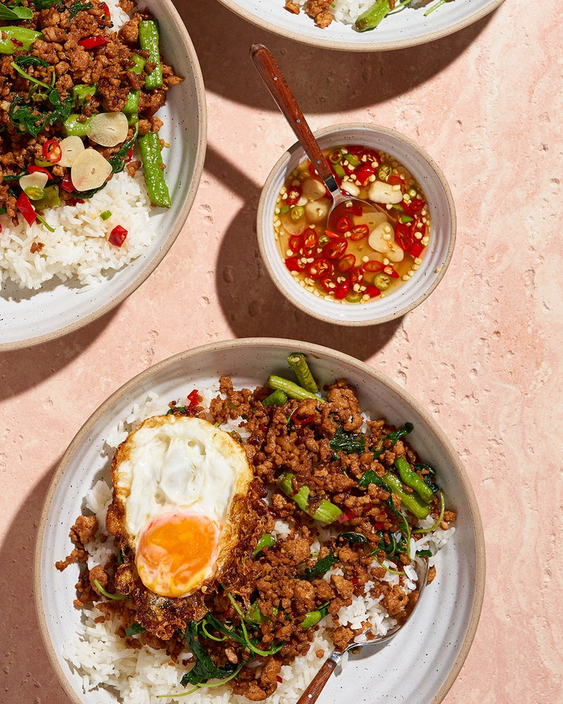 Pork Pad Kra Pow recipe CookDineHost feature image on table