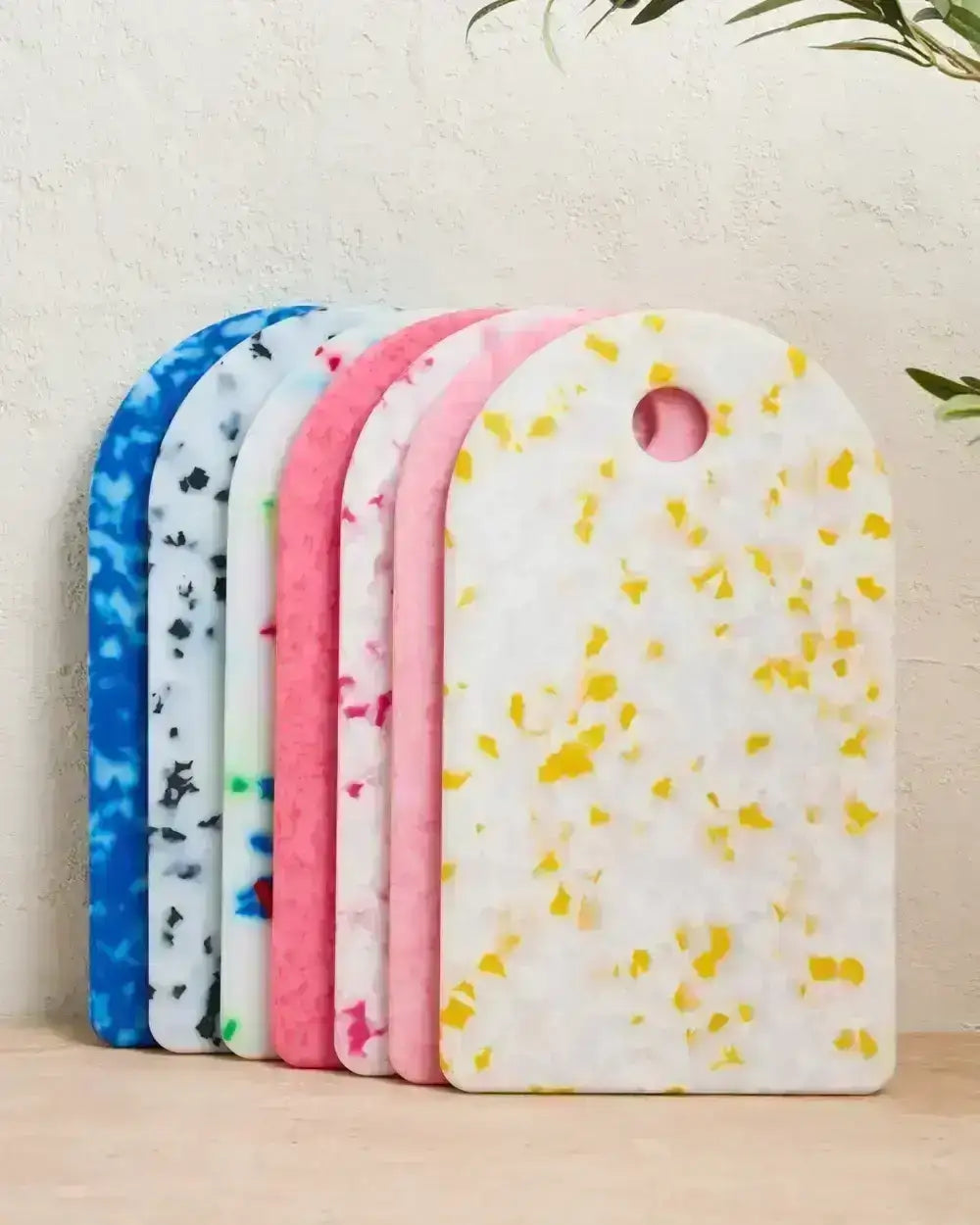 Colorful terrazzo-style chopping boards in blue, black, multicolor, pink, and yellow by chef Marion Grasby brand Asoke