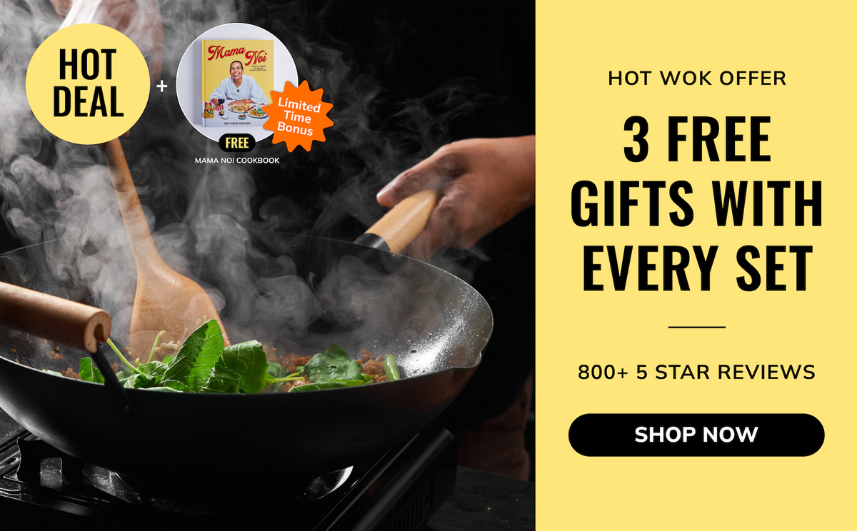 Promotional banner for a hot wok offer featuring a black wok with wooden handles on a stove, steam rising, and green vegetables cooking. A hand holds one handle.