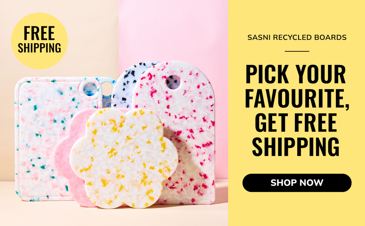 A promotional graphic for Sasni recycled boards showing several pastel speckled phone cases and a flower-shaped board. The left side has a beige background with the products, a yellow 'FREE SHIPPING' badge, and a pink backdrop behind them.
