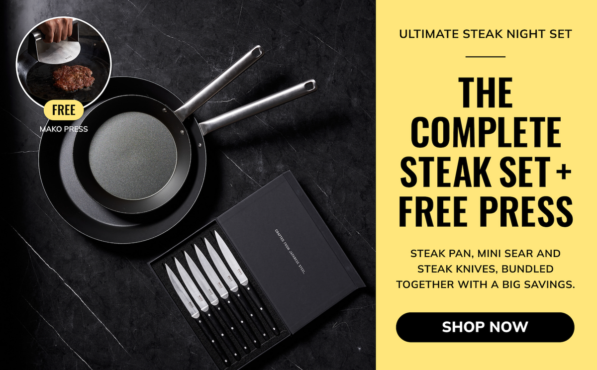 Ultimate Steak Night Set promotional graphic featuring a black skillet, a frying pan, a boxed set of steak knives, and a small inset showing a free nano press. The left side shows the cookware and knives on a dark textured surface, while the right side has a yellow panel with text reading 'Ultimate Steak Night Set' and 'The Complete Steak Set + Free Press' with a 'Shop Now' button.