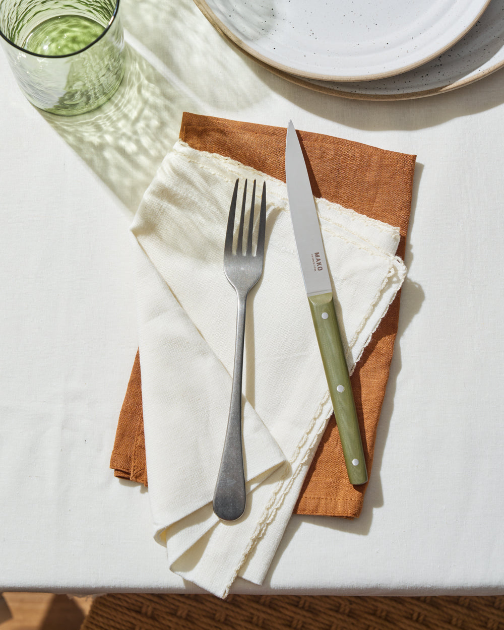 MAKO Steak Knife Set of 6 - Olive Green table setting earth and white coloured napkin, plate and glass