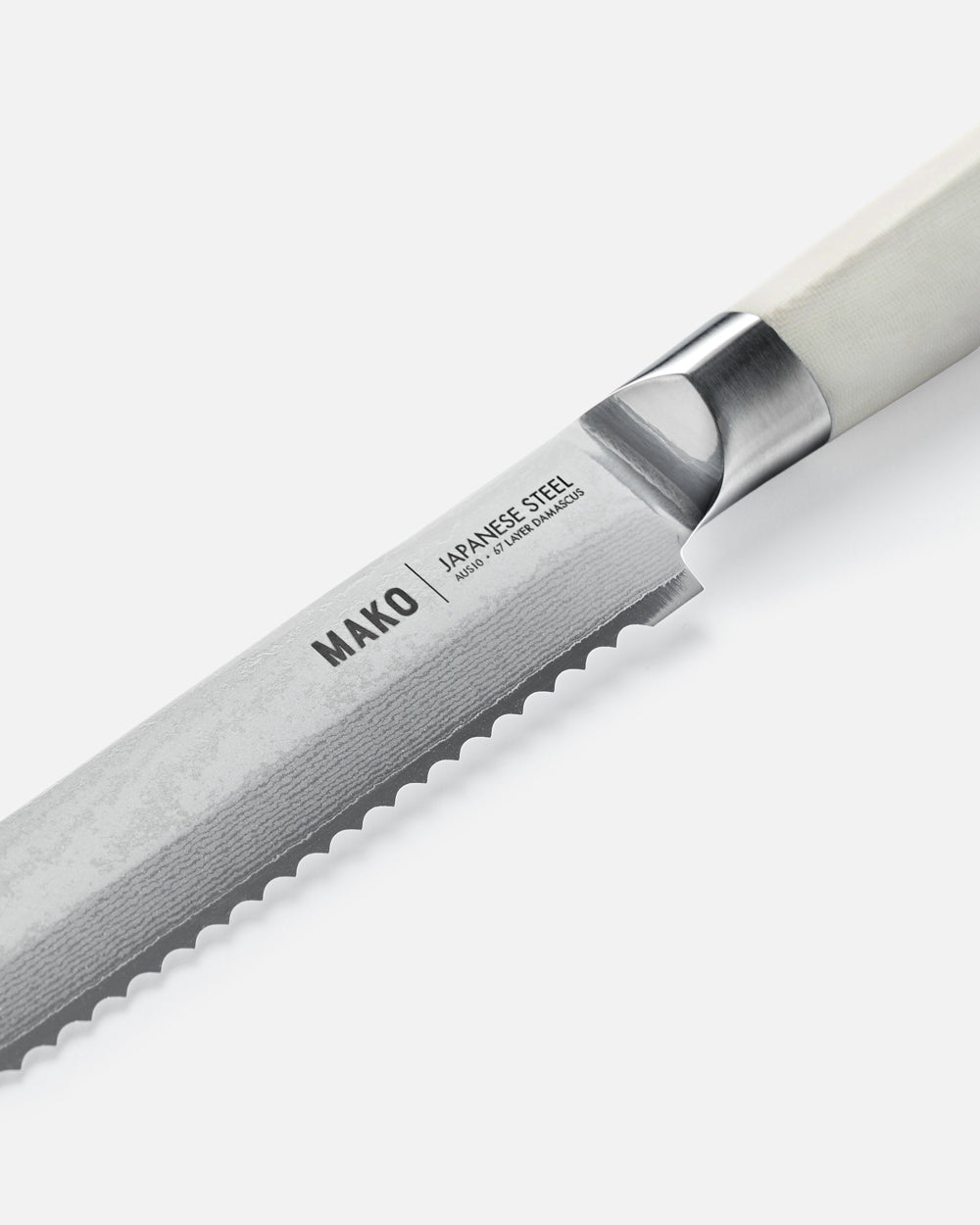 MAKO Japanese Steel Cream 8″ Bread Knife CookDineHost close up white background handle and blade detail