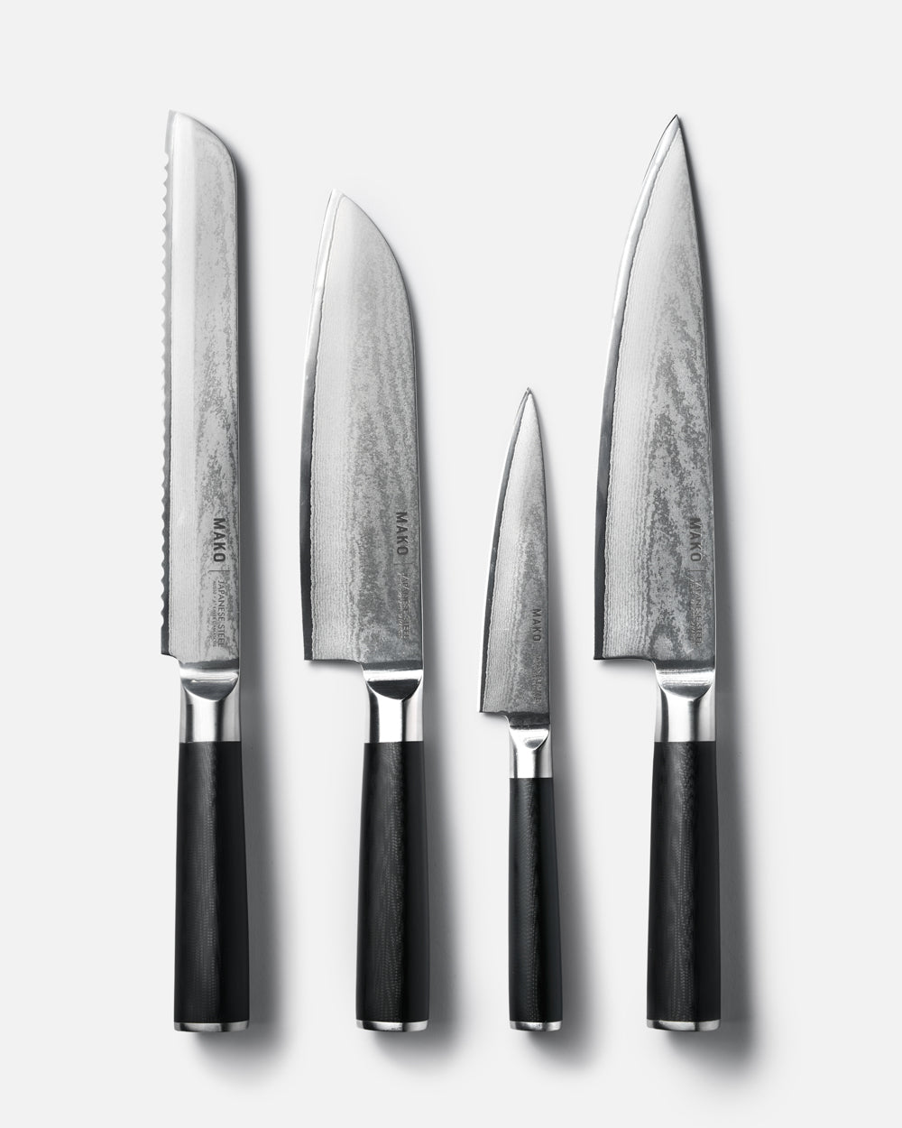 MAKO Japanese Steel Knife Set of 4 - Black flat on white background tips upwards
