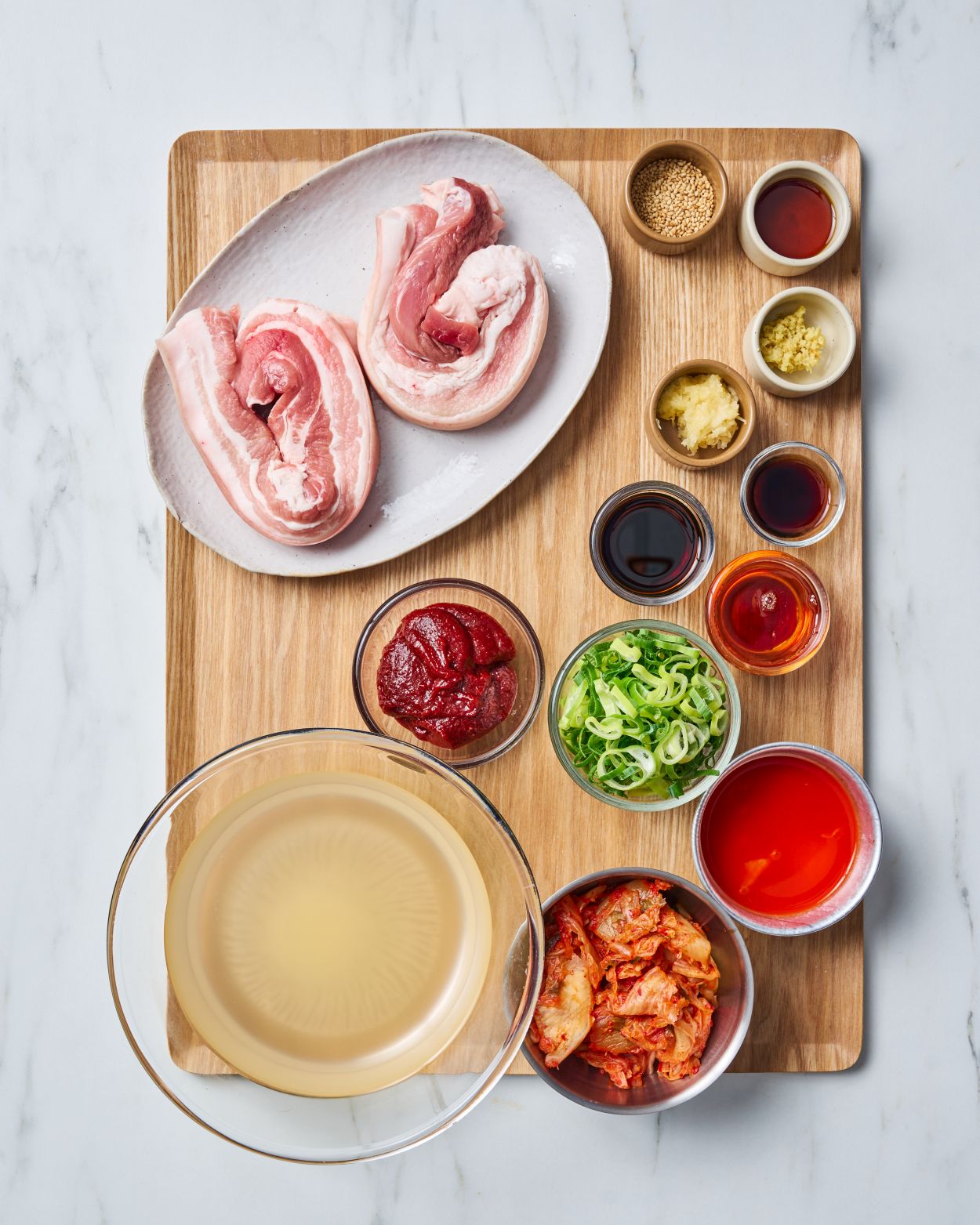 Sticky Gochujang Pork Belly with Kimchi Rice Recipe CookDineHost Ingredients flat laid on tray