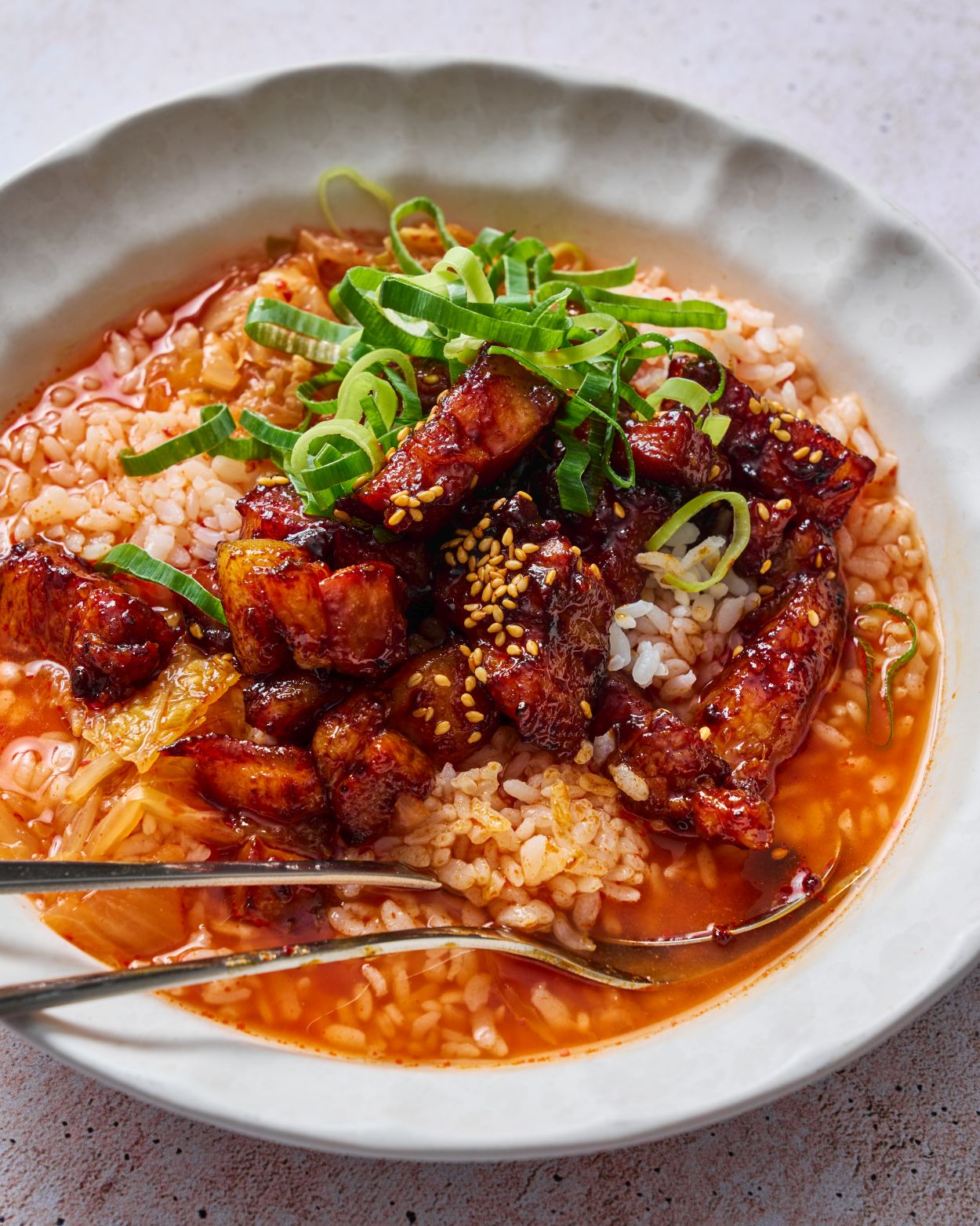 Sticky Gochujang Pork Belly with Kimchi Rice Recipe CookDineHost styled shot in bowl ready to eat