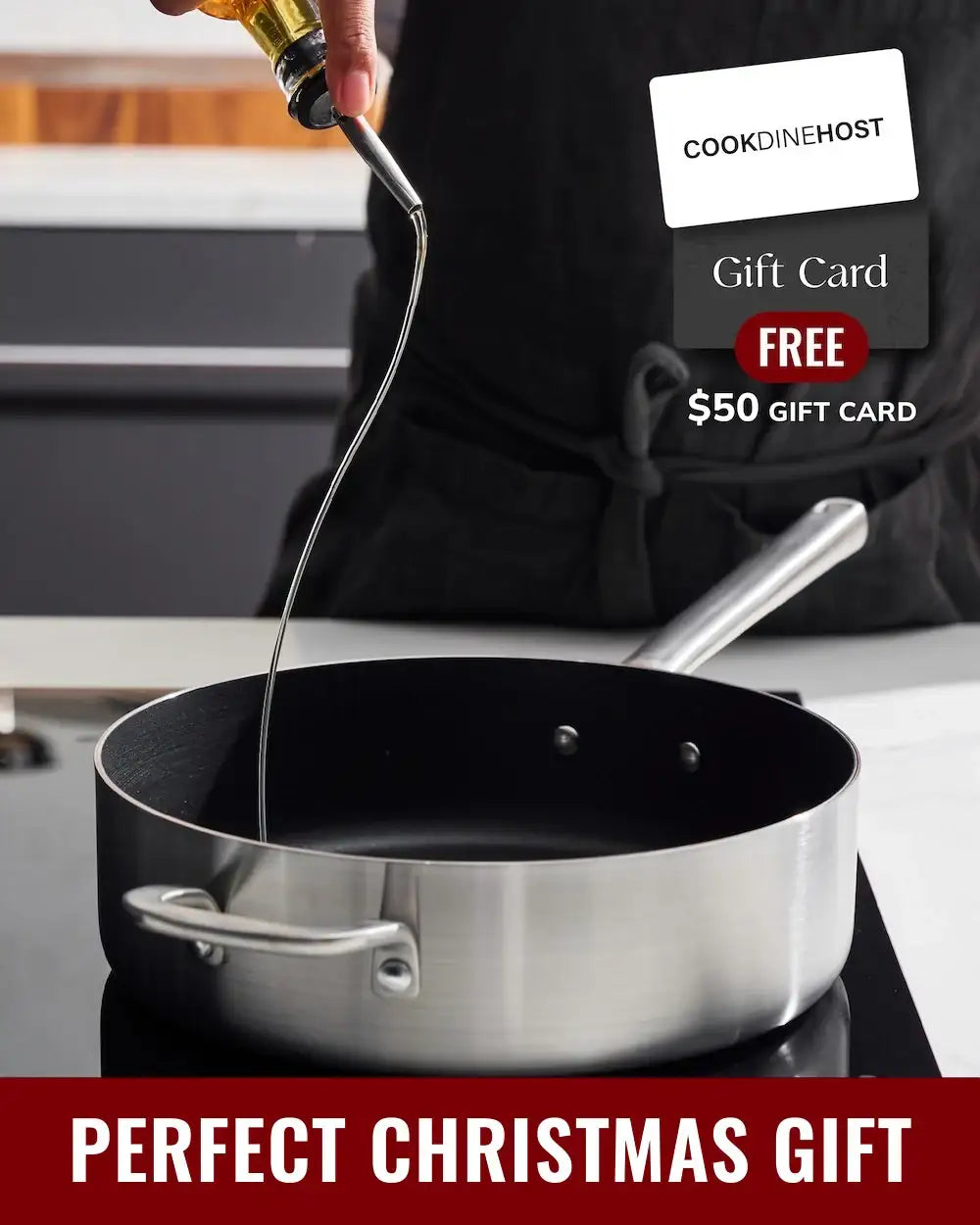 Hand pouring oil into stainless steel frying pan in modern kitchen with CookDineHost gift card offer