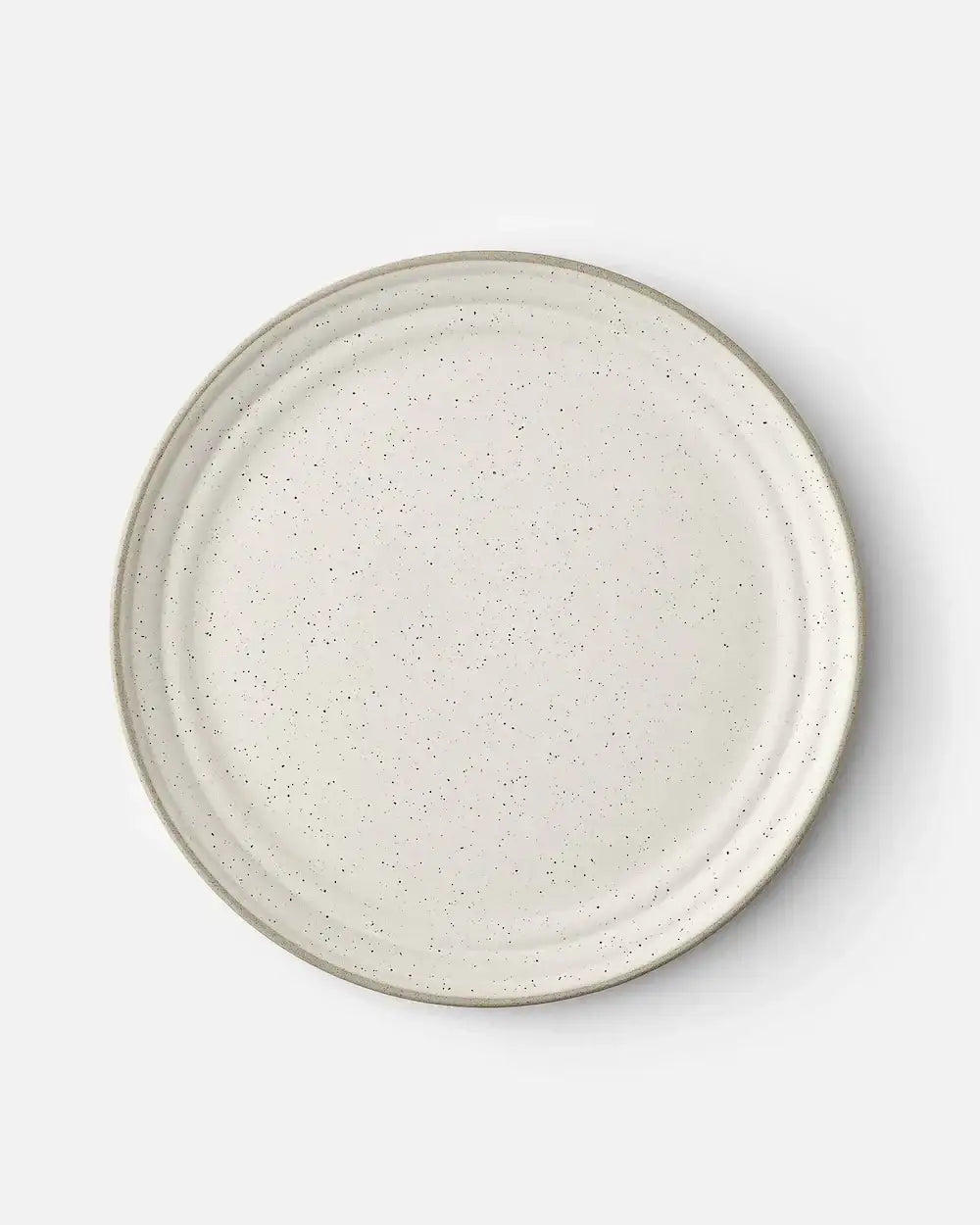 Marion Grasby speckled white ceramic dinner plate with subtle ridged design on white background