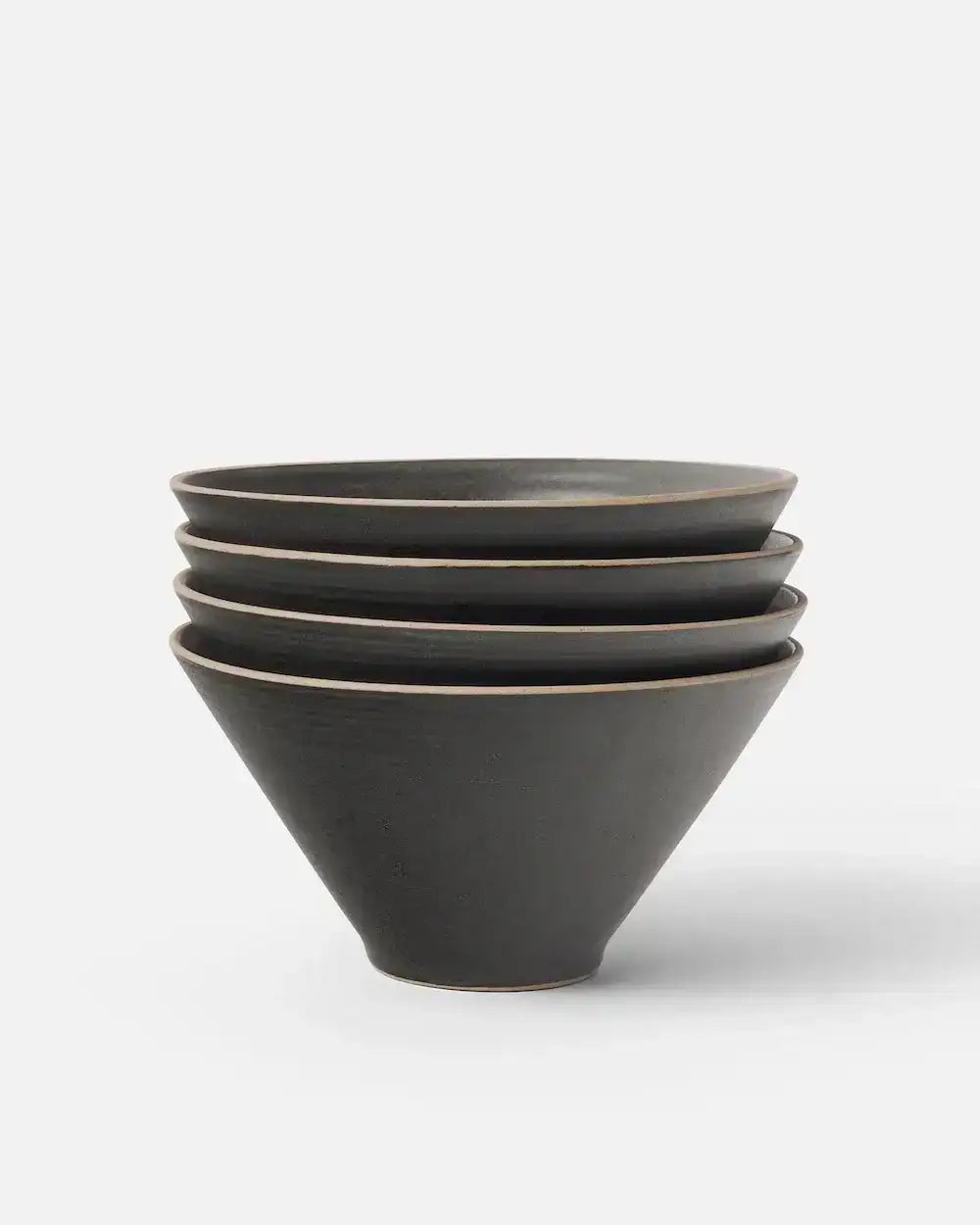 Stack of four charcoal black Asoke noodle bowls with a matte finish by Marion Grasby