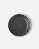 Charcoal ceramic side plate with a textured surface and natural rim by Marion Grasby's Asoke collection