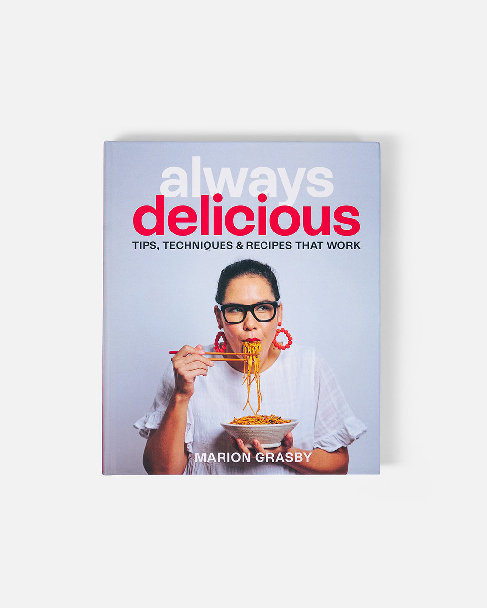 Always Delicious cookbook by Marion Grasby, woman eating noodles with chopsticks on cover