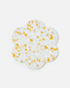 Flower-shaped resin coaster with white base and yellow-orange specks by Marion Grasby