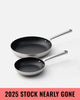 Two stainless steel frying pans with non-stick black interiors by Marion Grasby, promo for 2025 stock