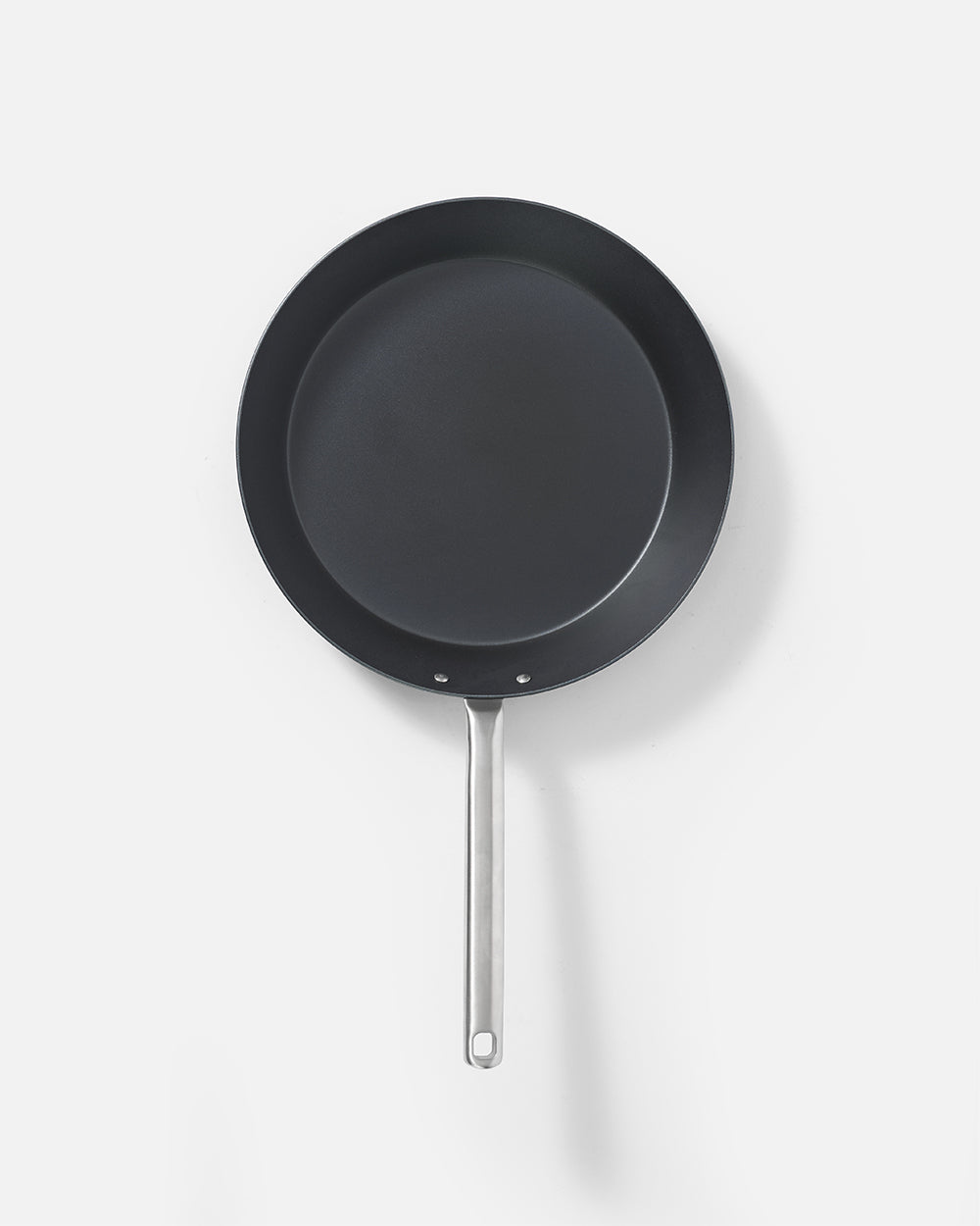 Nonstick steak pan with stainless steel handle on white background