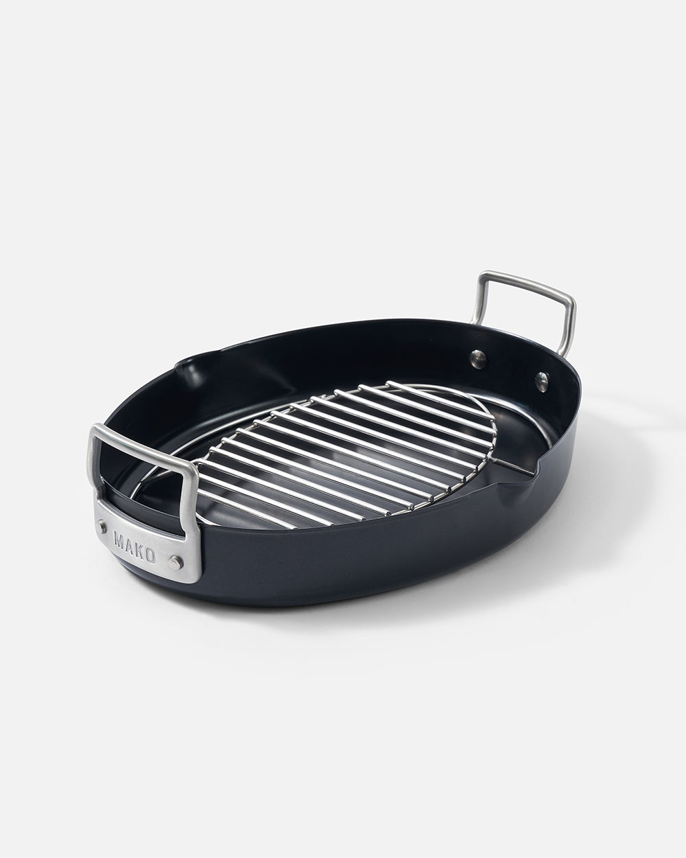 Oval nonstick roasting pan with stainless steel rack and silver handles on white background