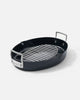 Black oval Mako roasting pan with stainless steel handles and removable grill rack by Marion Grasby