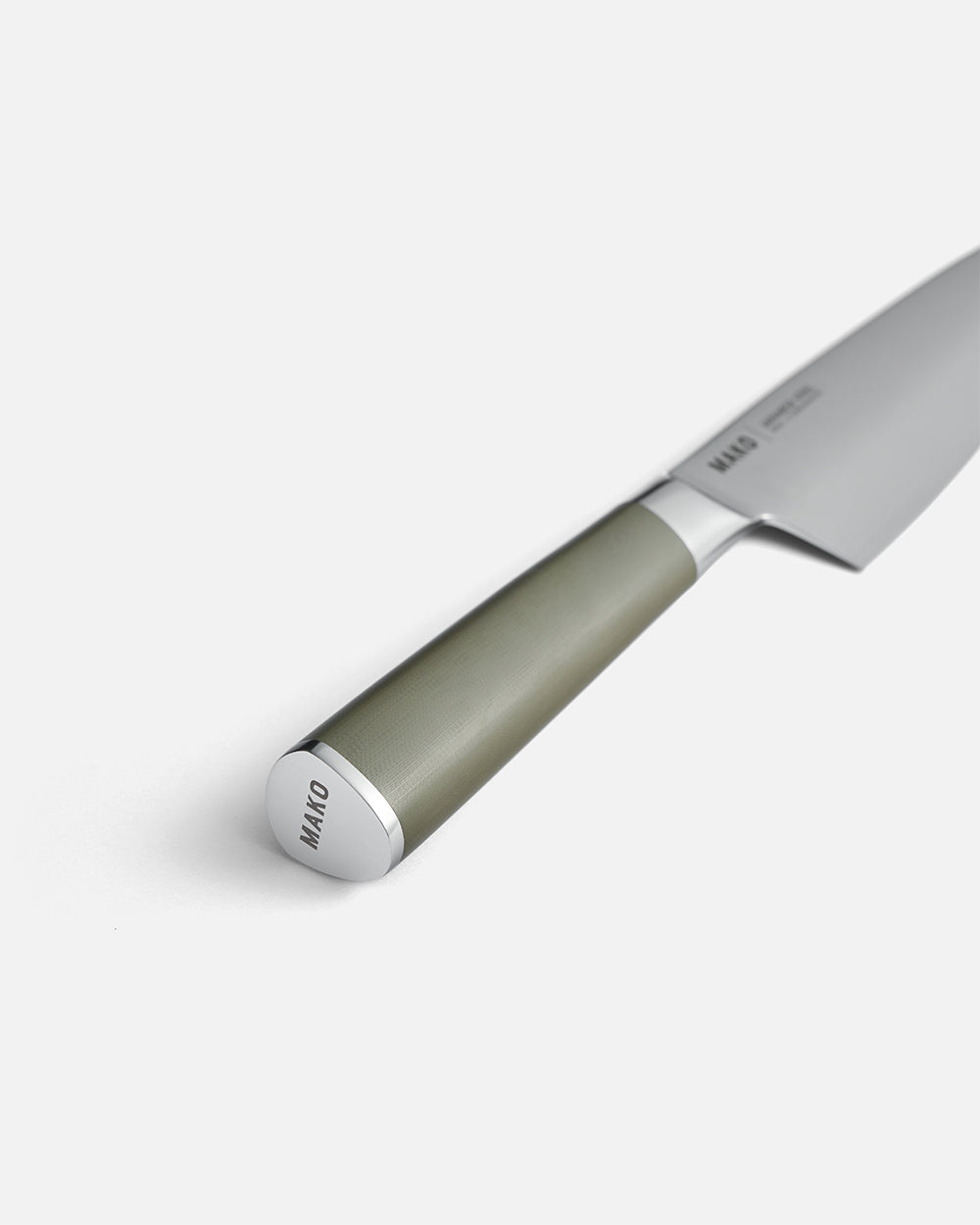 Stainless steel chef knife with olive green handle on white background