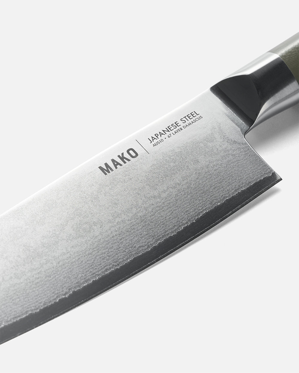 Close-up of MAKO Japanese steel chef knife with olive green handle on white background