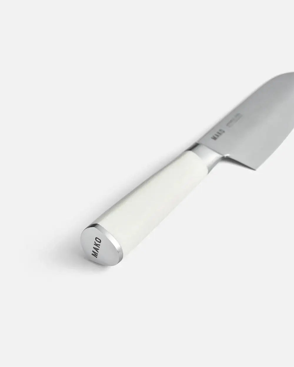 Mako Santoku knife with white handle and stainless steel blade by Marion Grasby on white background