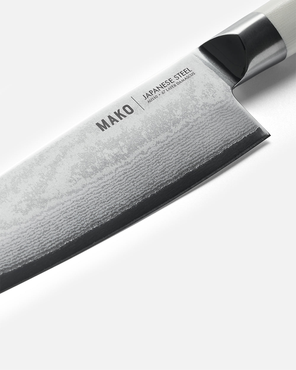 Close-up of MAKO Santoku knife with Japanese steel blade and cream handle on white background