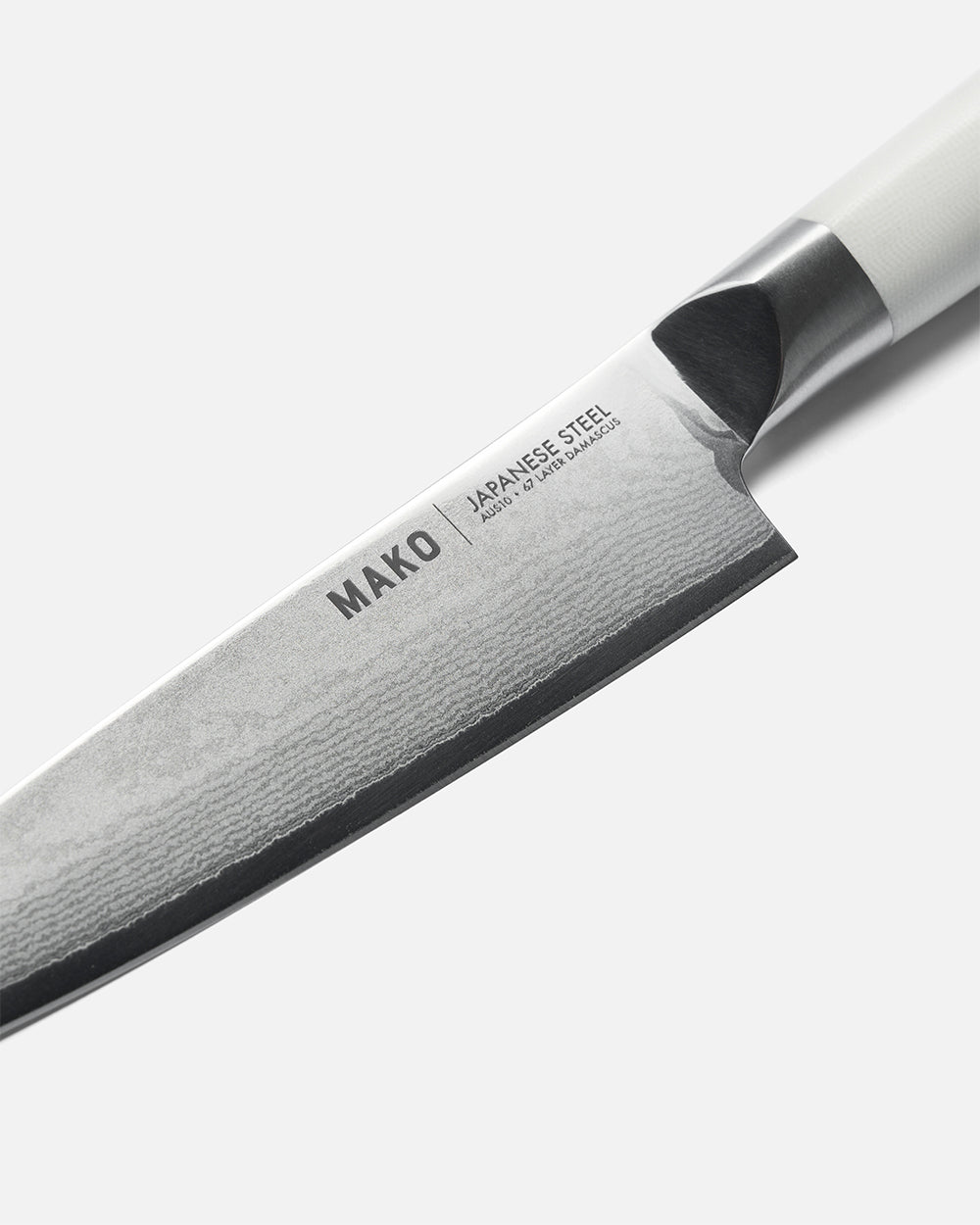 Close-up of MAKO Japanese steel utility knife with cream handle on white background