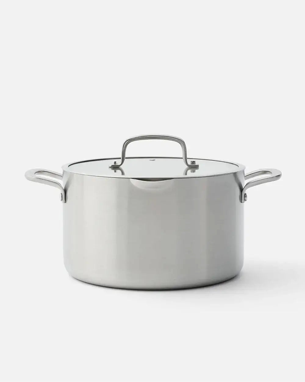 Stainless steel stockpot with lid and side handles, clean studio background, Marion Grasby Mako cookware