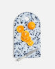 Dalmatian pattern cutting board with sliced orange, whole orange, and white-handled knife by Marion Grasby