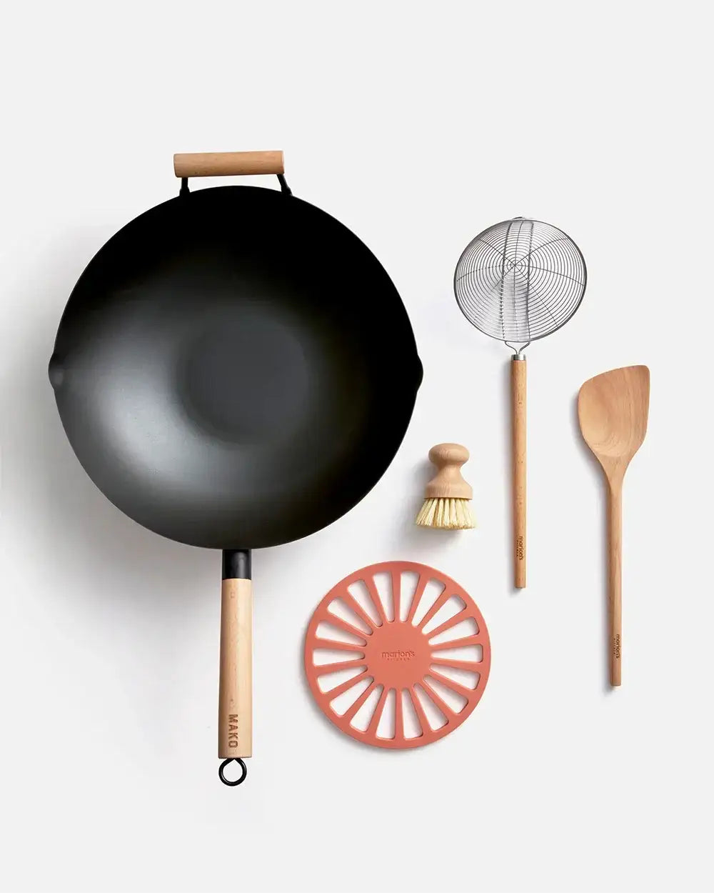 Mako wok set with wooden handles, strainer, brush, spatula, and trivet by Marion Grasby