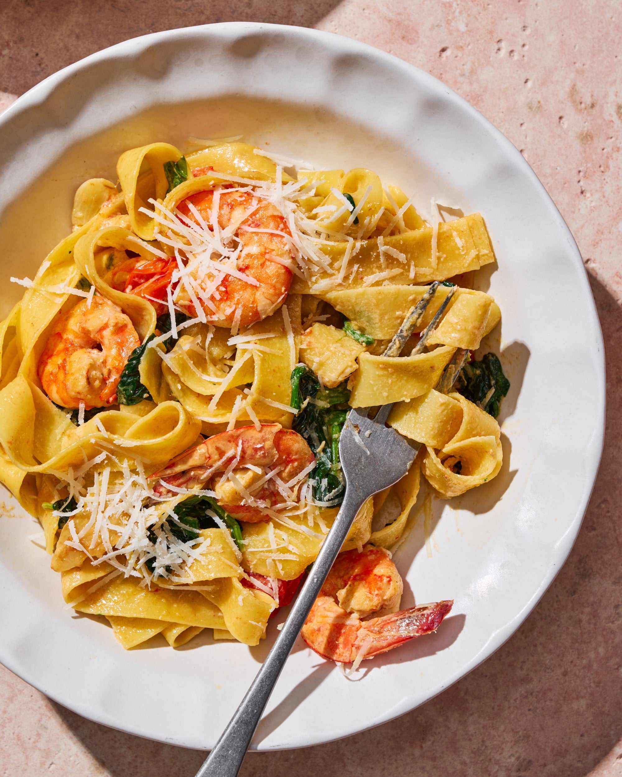 Creamy Garlic Prawn Pappardelle CookDineHost Recipe on plate with fork ready to eat