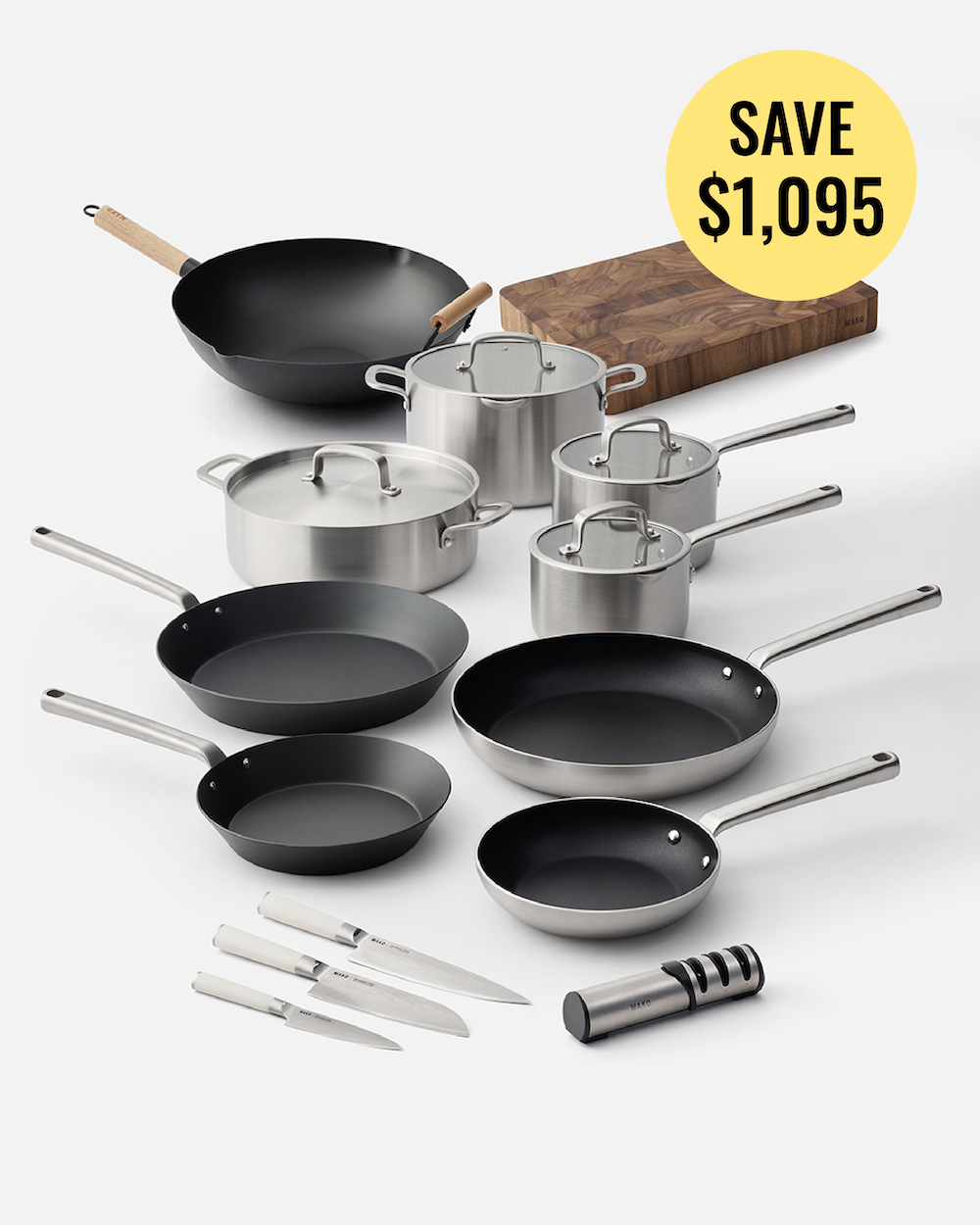 A 12-piece cookware set arranged on a light gray background, including black and stainless steel pans, pots with lids, three knives with white handles, a wooden cutting board, and a metal whistler. A yellow circular badge in the top right reads 'SAVE $1,095'.