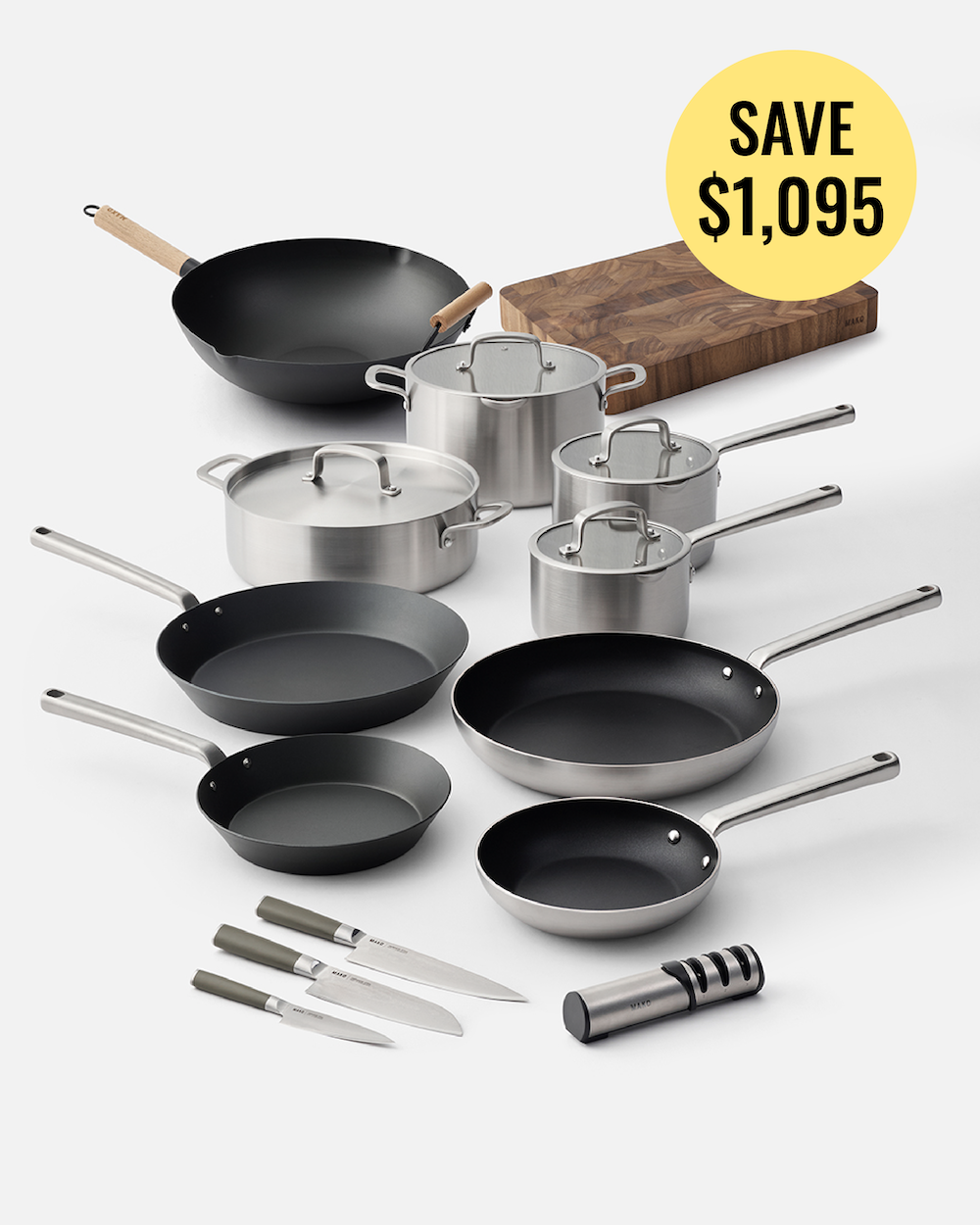 A 12-piece cookware set arranged on a light gray background, including black and stainless steel pans, pots with lids, three knives, a wooden cutting board, and a cylindrical utensil. A yellow circular badge in the top right reads 'SAVE $1,095'.