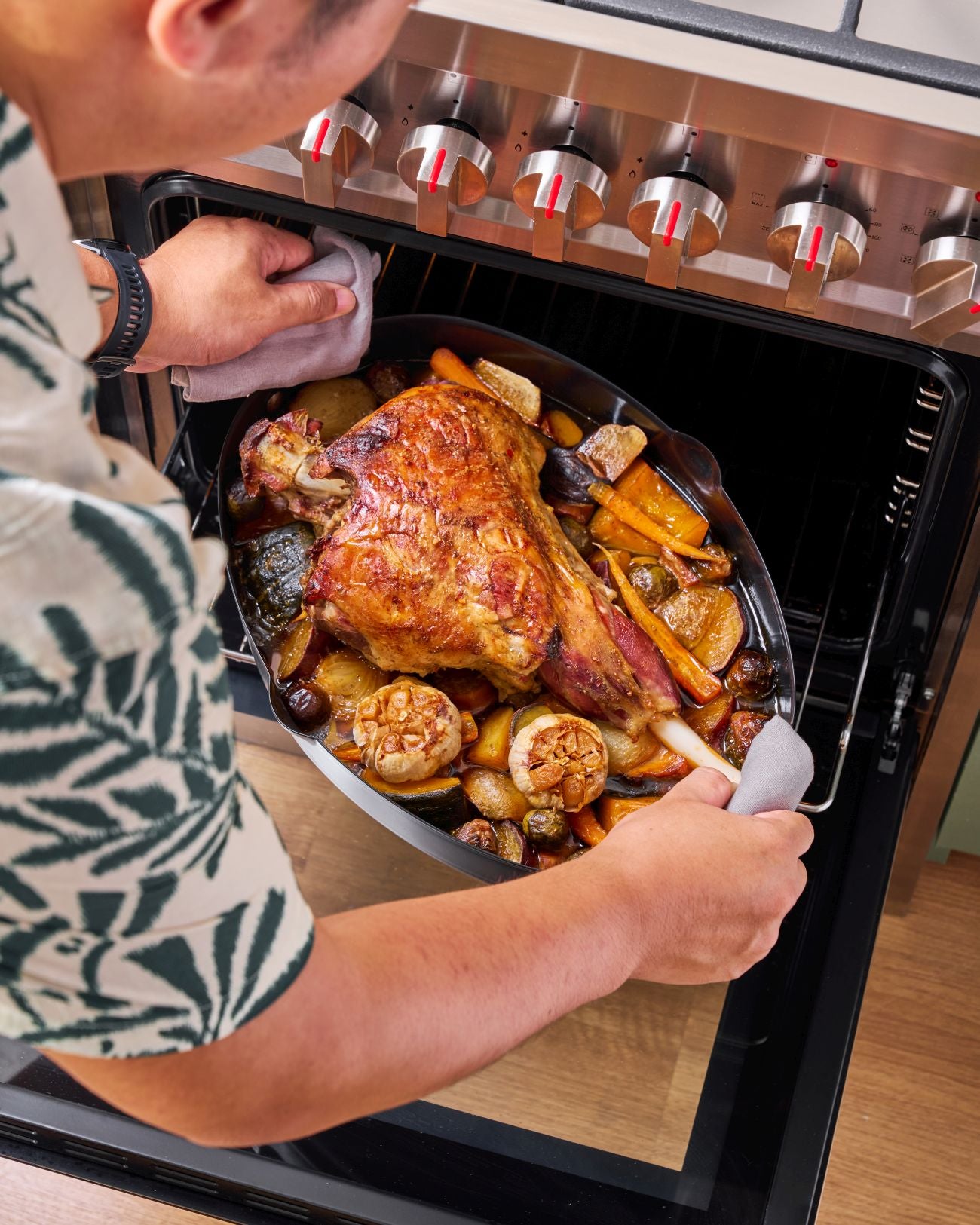 Slow-Roasted Leg of Lamb with Herb Yoghurt Marinade Recipe CookDineHost  finished lamb in roaster getting out of oven