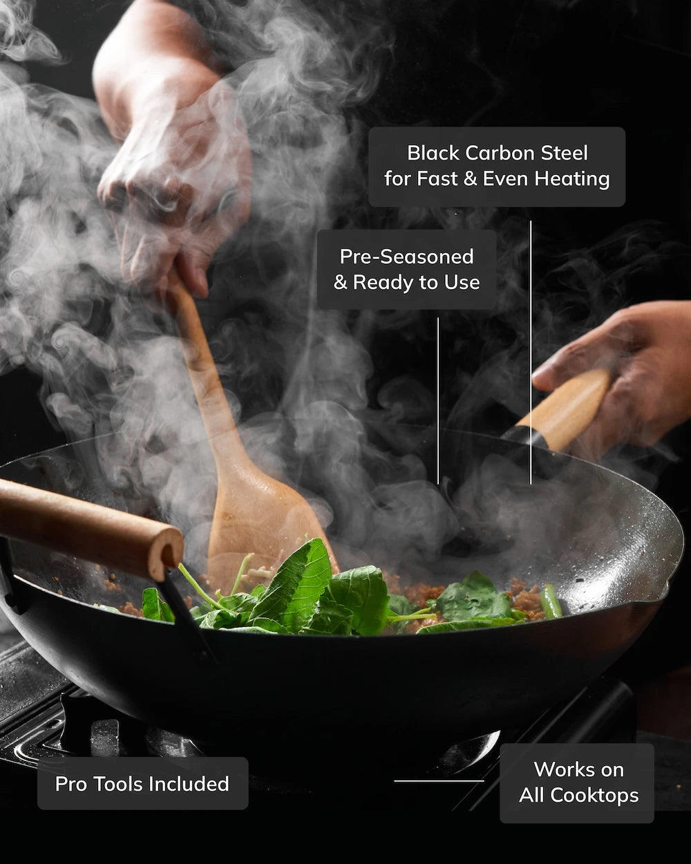 Hand stirring fresh ingredients in a steaming black carbon steel wok with wooden utensils on stovetop.