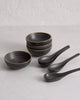 Asoke charcoal 24-piece dinnerware set featuring charcoal bowls and spoons by Marion Grasby