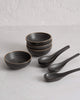 Asoke charcoal 24-piece dinnerware set featuring charcoal bowls and spoons by Marion Grasby
