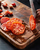 MAKO Master 18 All-Purpose Chopping Board CookDineHost cutting tomatoes with juice running