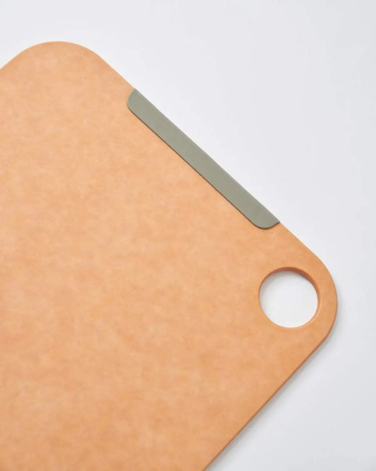 Mako non-slip wood fibre chopping board with rounded corner and hole, designed by Marion Grasby