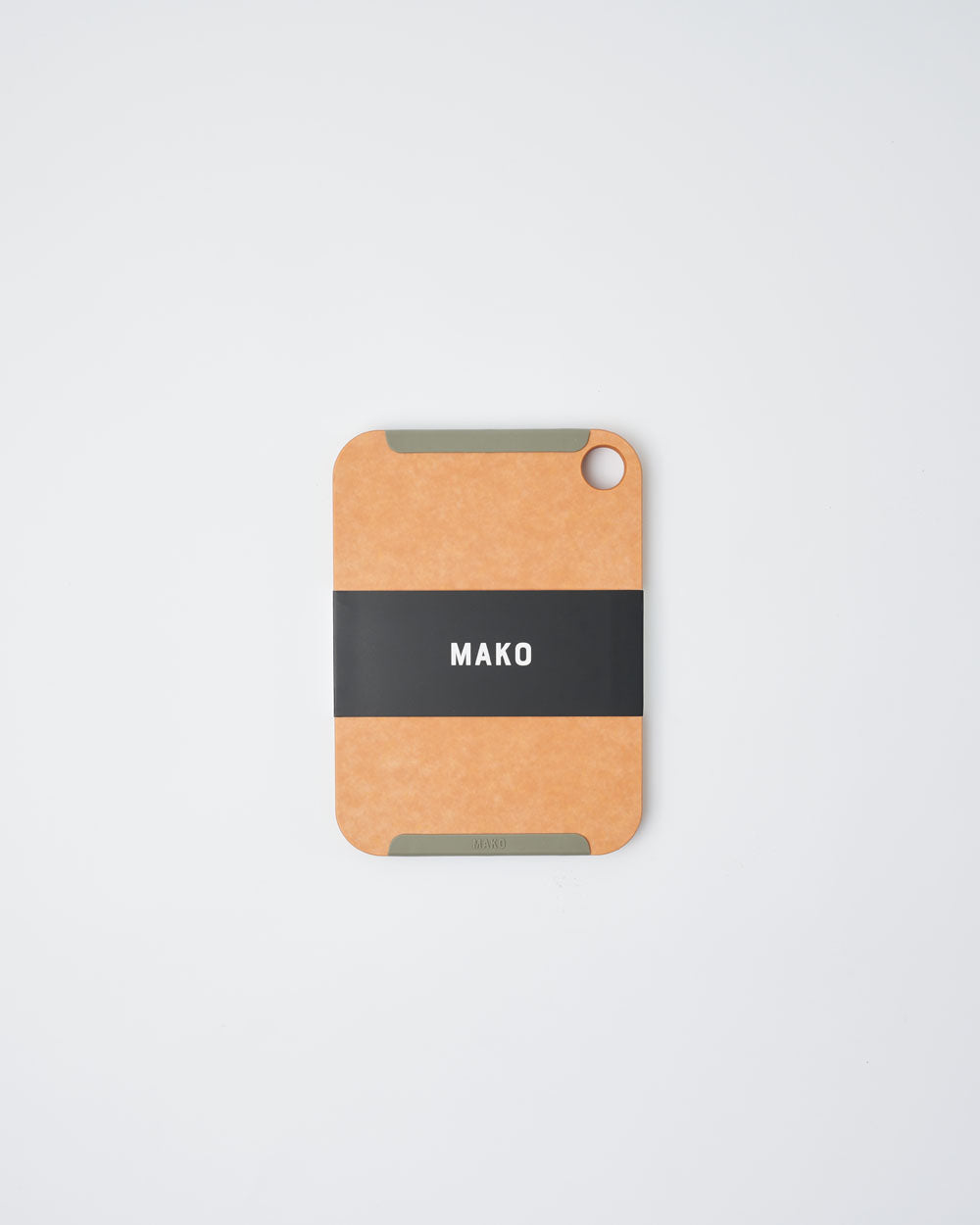 Small non-slip wood fibre chopping board with rounded corners and a hole for hanging